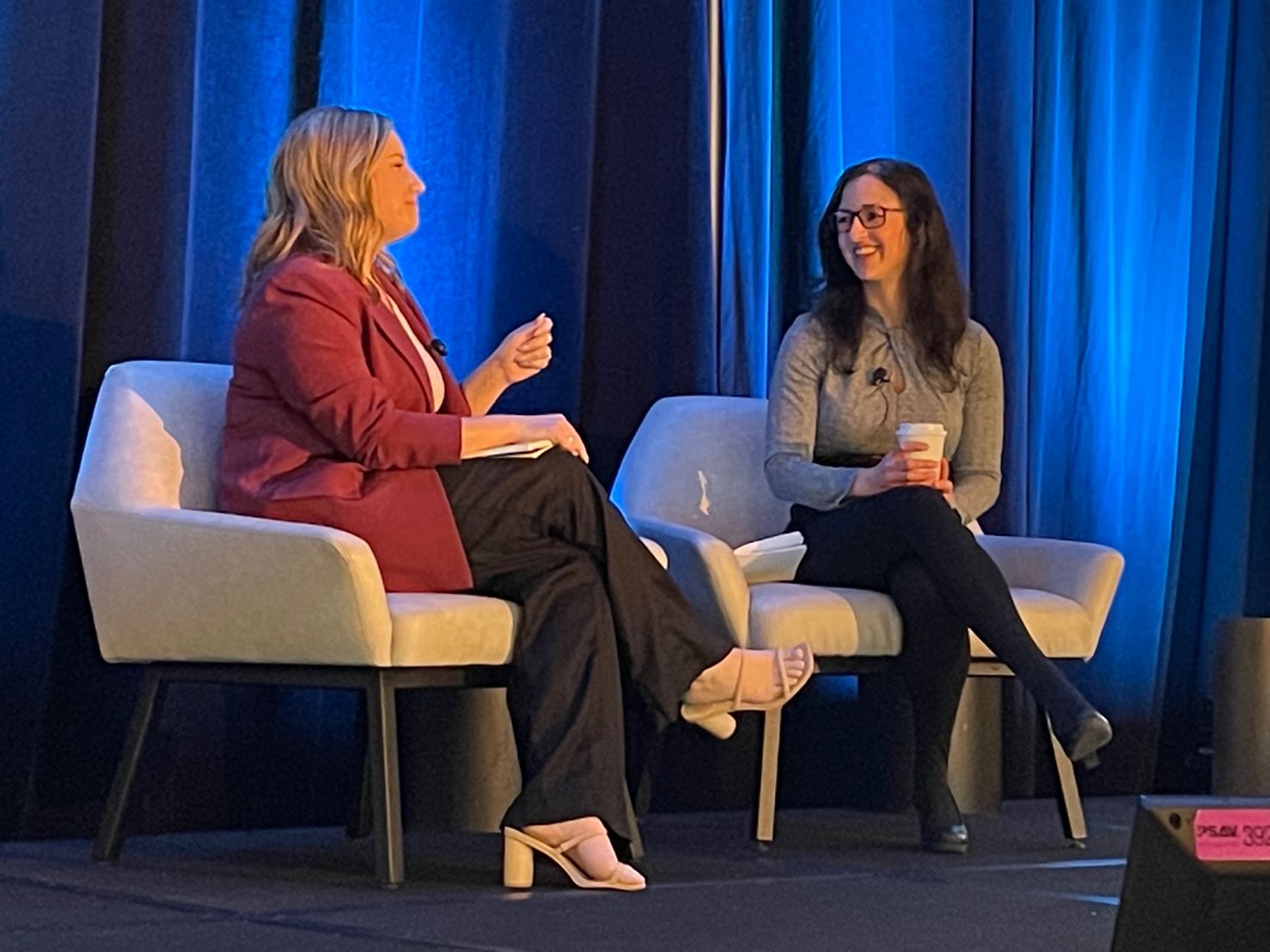Tanya Little moderating an executive panel